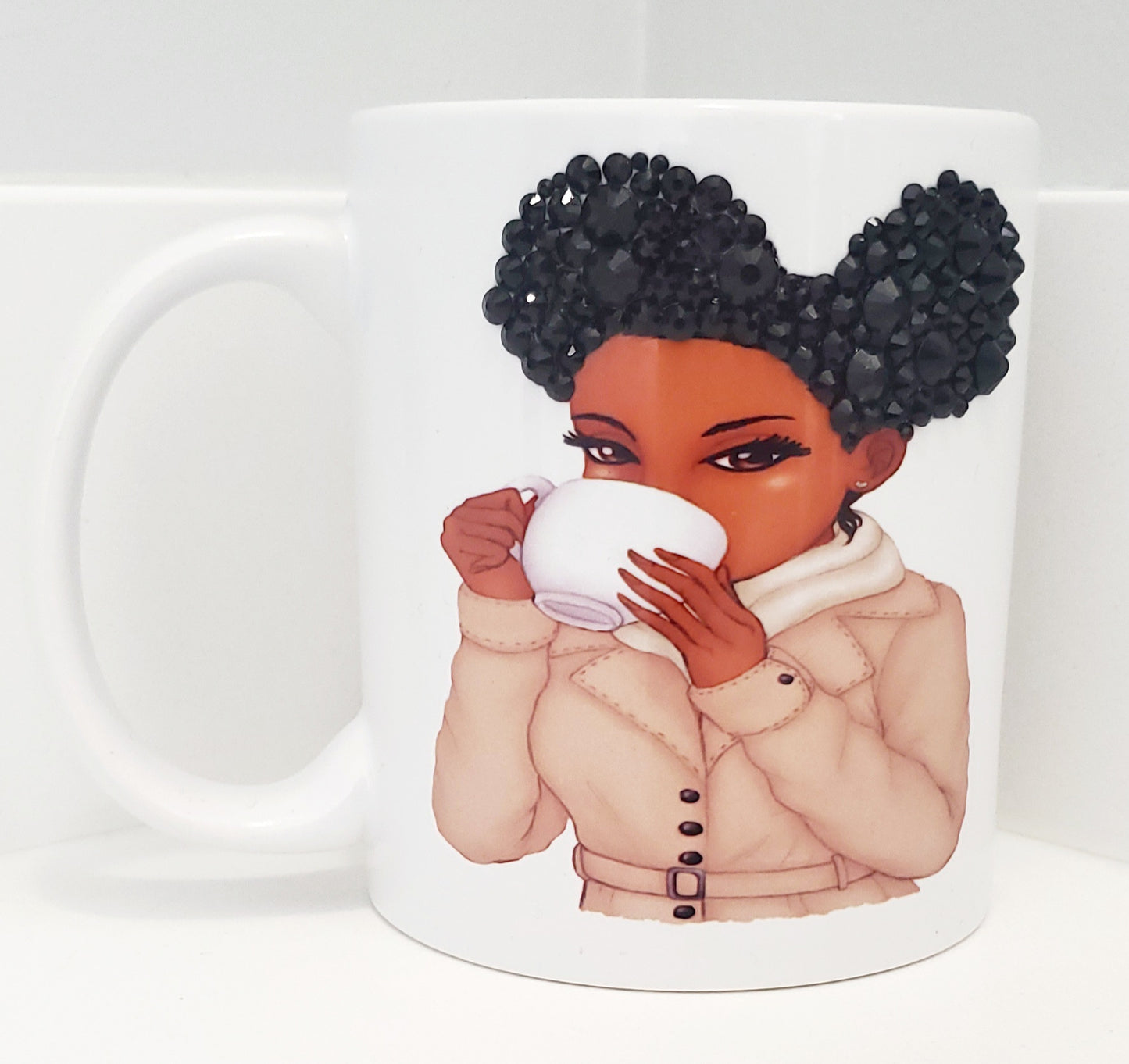 Blinged hair puffs sipping mug
